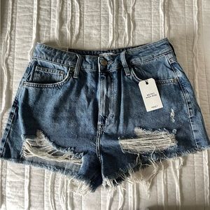 High-rise ripped denim shorts